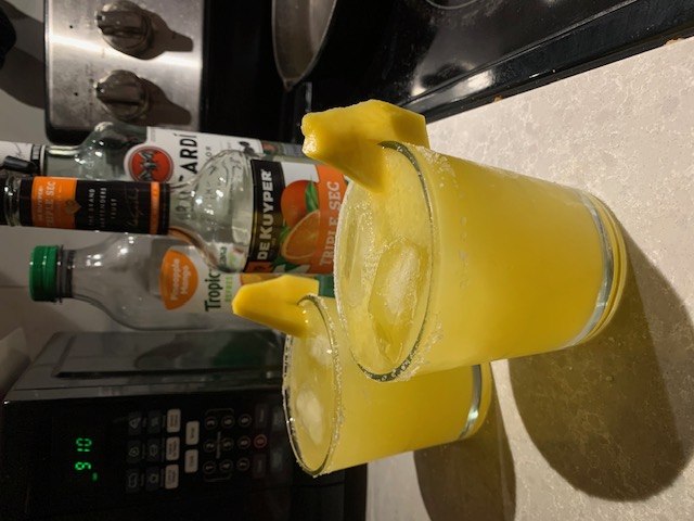 Mango Margarita garnished with mango and salt